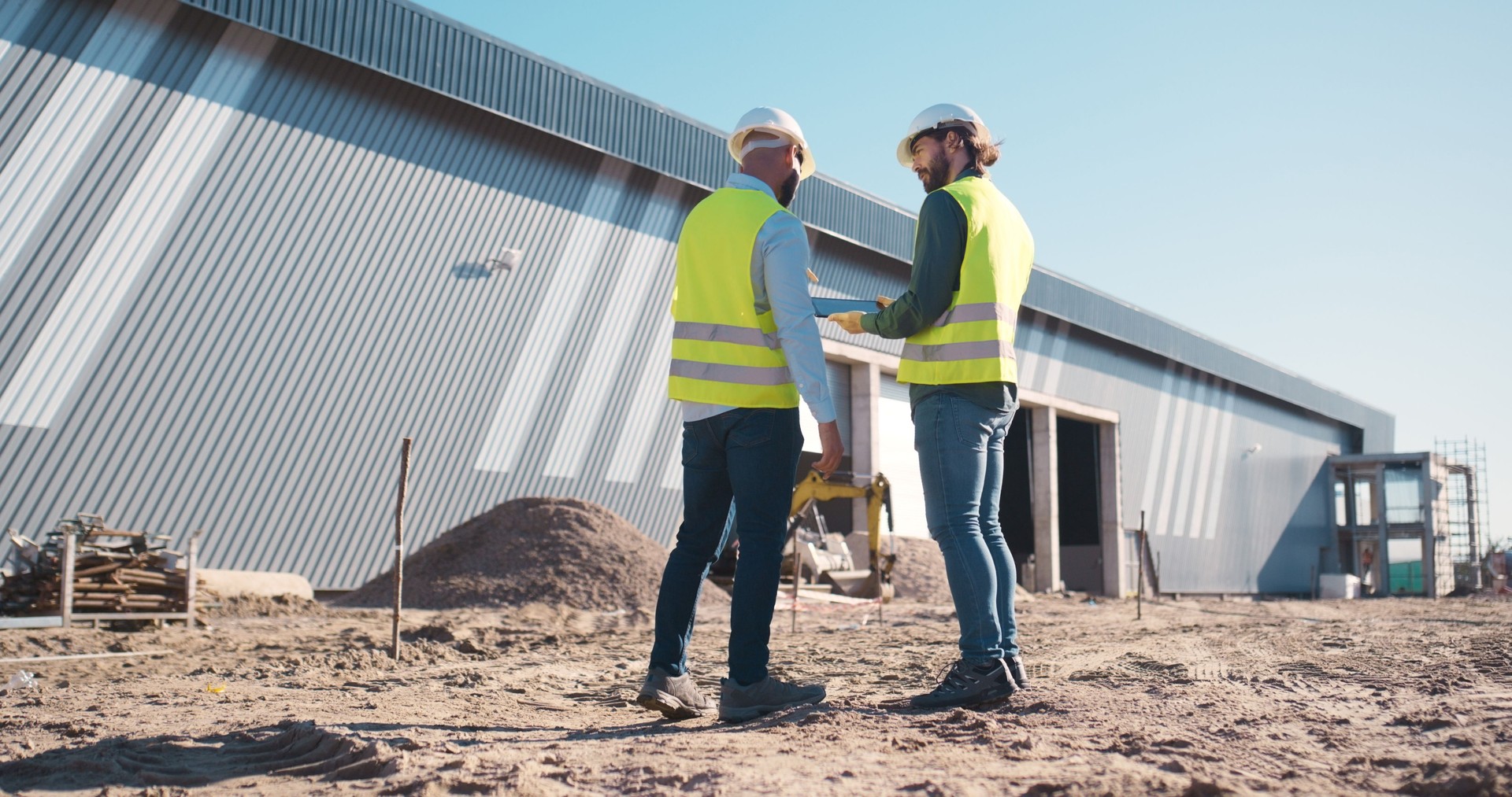 Construction site, tablet and engineering team, outdoor planning, building or floor plan development. Project manager or people back on digital technology for outdoor architecture and property design